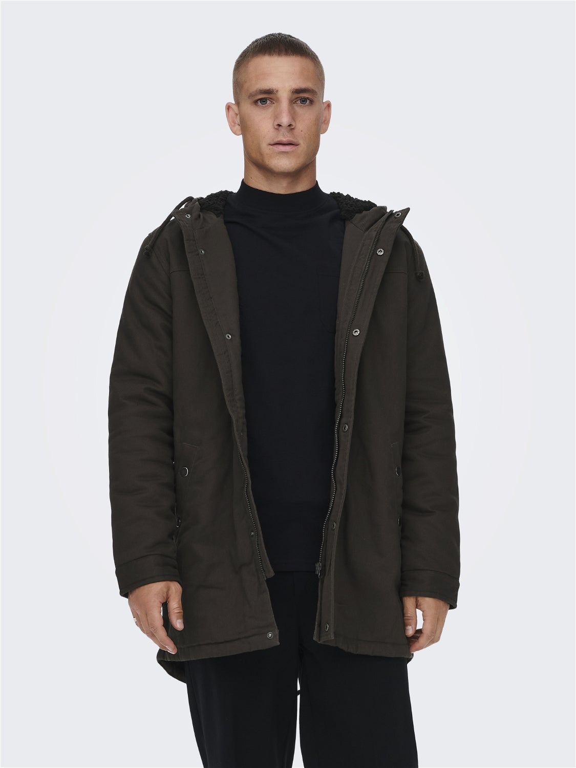 Hood with string regulation Buttoned cuffs Jacket