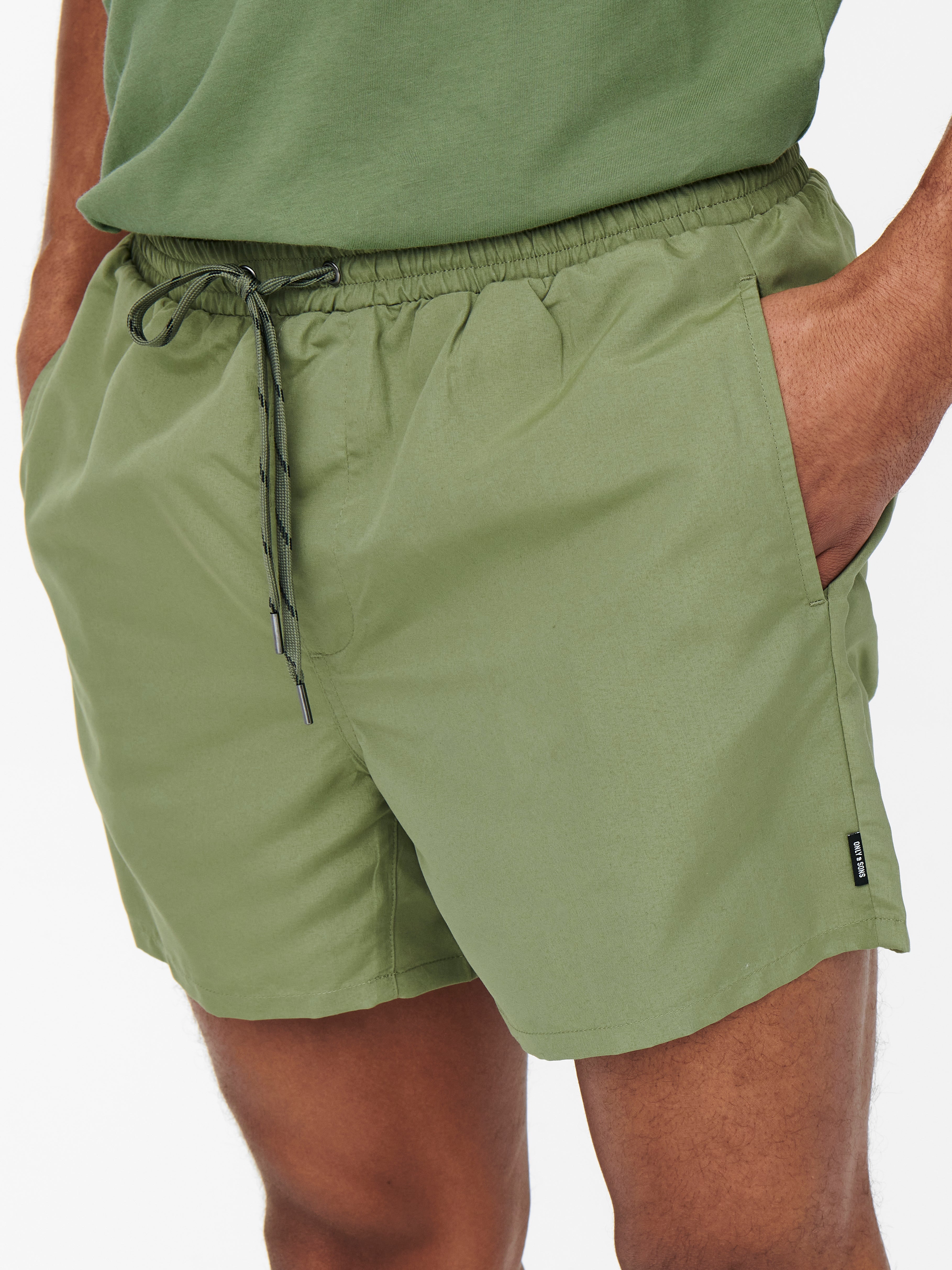 Solid colored Swim shorts with 20 